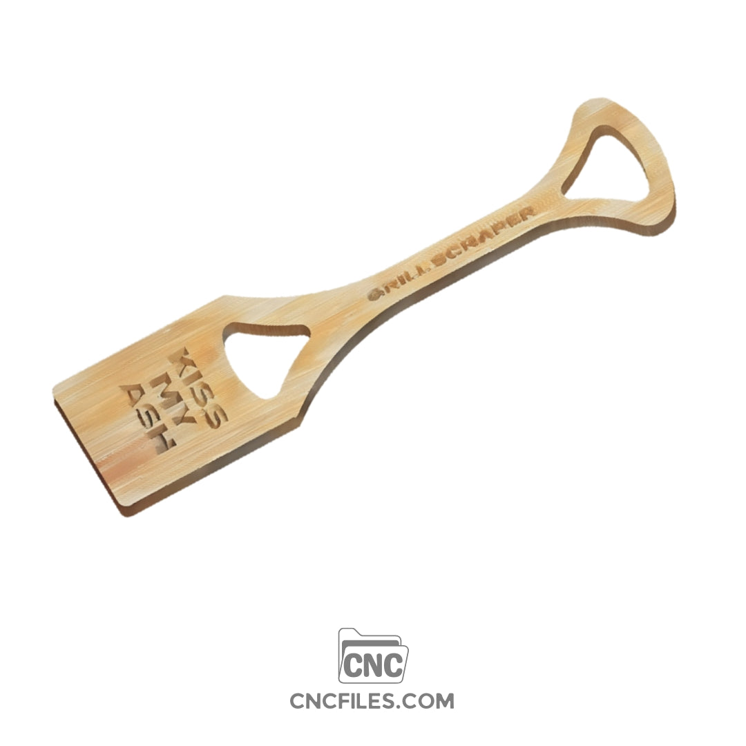 An image of a CNC file showing a grill scraper design with the engraved phrase “Kiss My Ash,” created for cutting and engraving projects.