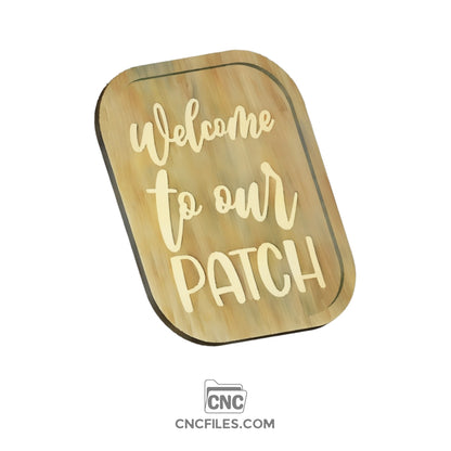 CNC file of wooden tray with an engraving of "welcome to our patch" on the base